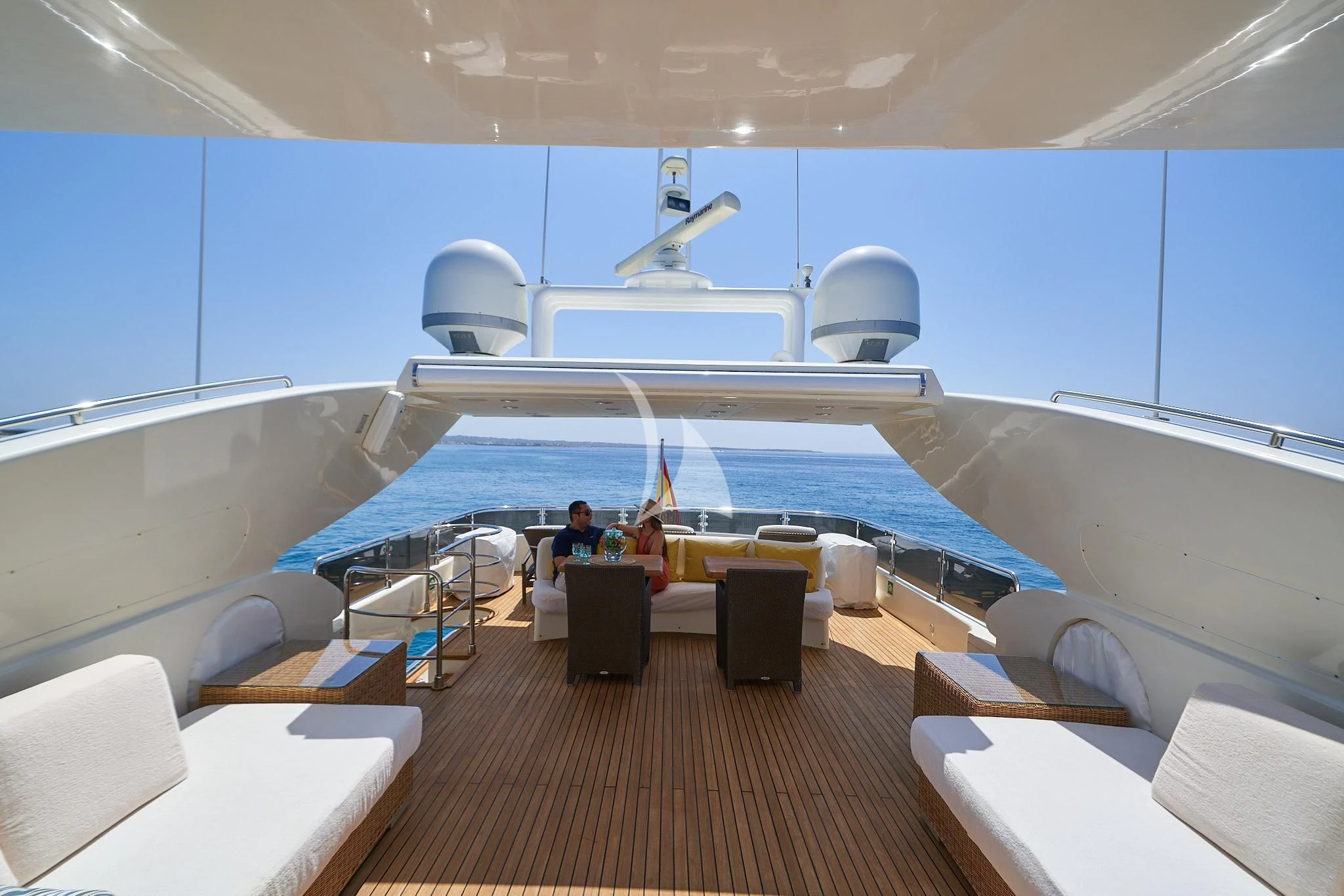 a person sitting at a table on a boat aboard KIRIOS Yacht for Sale