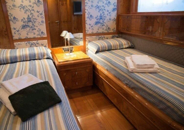 a couple of beds in a room aboard KIRIOS Yacht for Sale