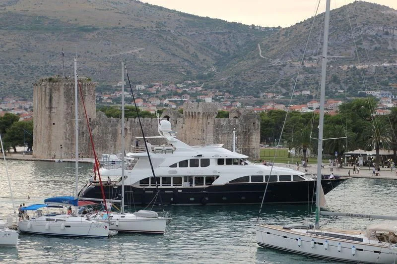 a group of boats in a harbor aboard SEA BLUEZ Yacht for Charter