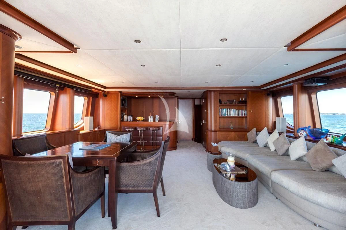 a living room with a couch and a table aboard SEA BLUEZ Yacht for Charter