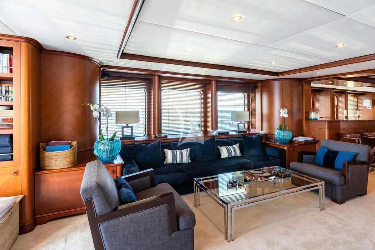 a living room with leather couches and a coffee table aboard SEA BLUEZ Yacht for Charter