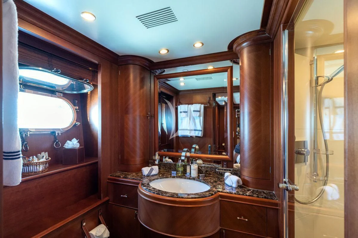 a bathroom with a sink and a mirror aboard SEA BLUEZ Yacht for Charter