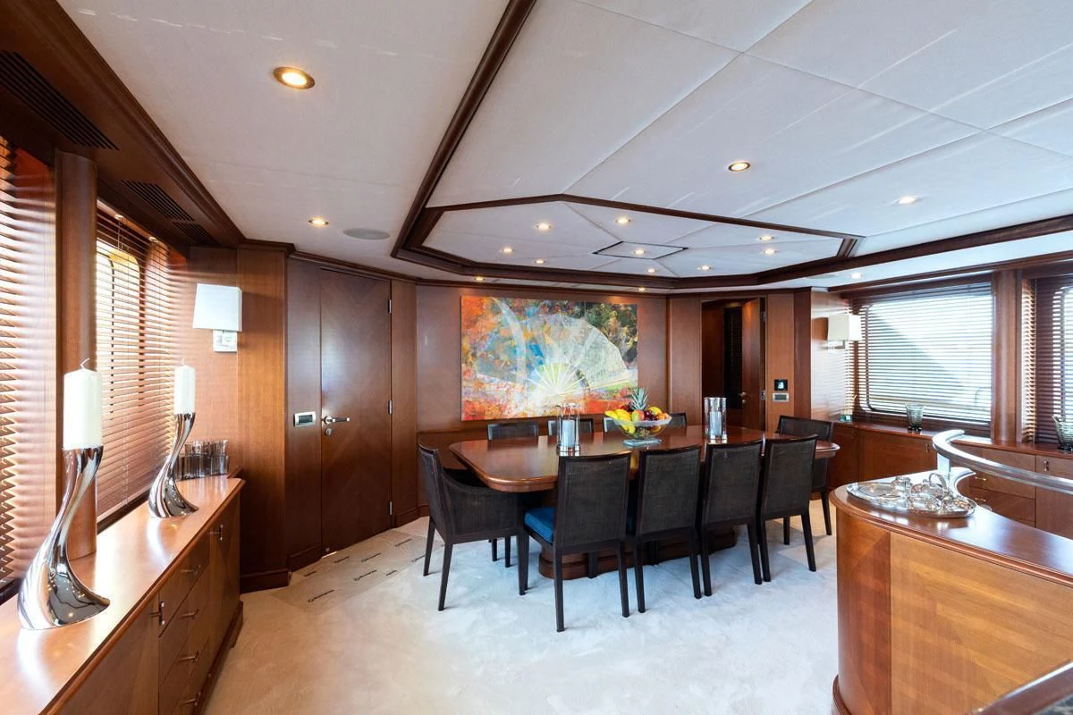 a large room with a table and chairs aboard SEA BLUEZ Yacht for Charter