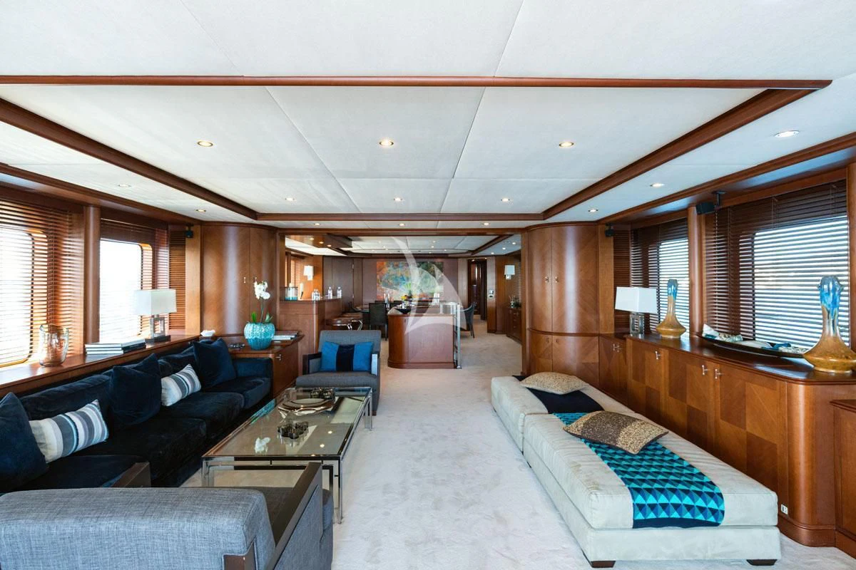 a large living room with a large window aboard SEA BLUEZ Yacht for Charter