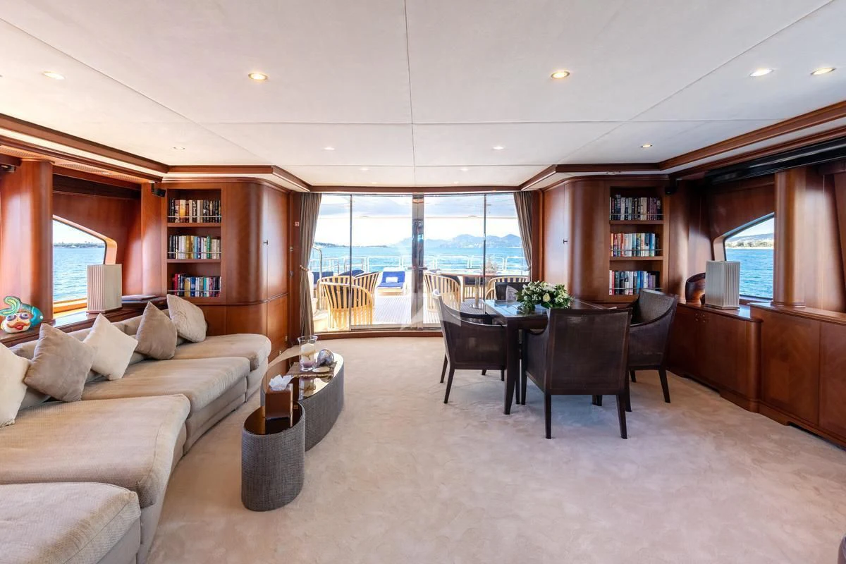 a living room with a couch and a table aboard SEA BLUEZ Yacht for Charter