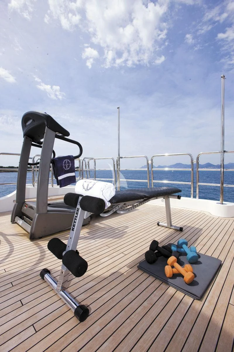 a deck with a slide and a pool and blue sky aboard SEA BLUEZ Yacht for Charter