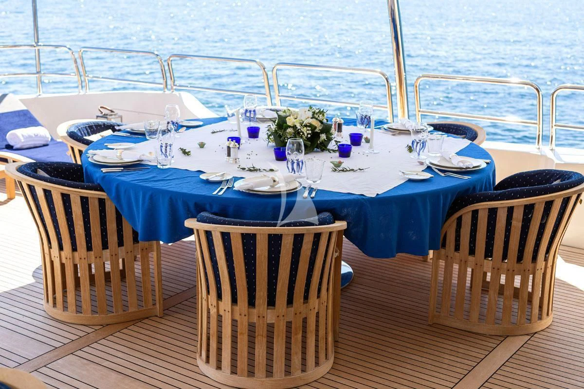 a table set for a dinner aboard SEA BLUEZ Yacht for Charter
