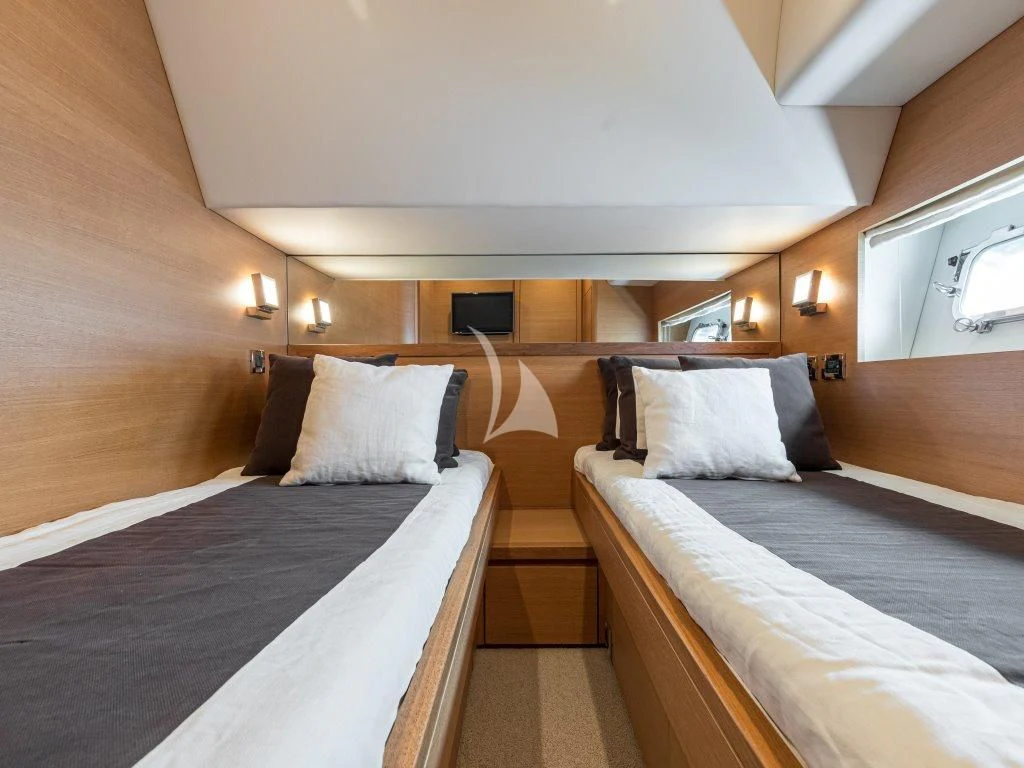 a room with two beds aboard PASSION Yacht for Sale