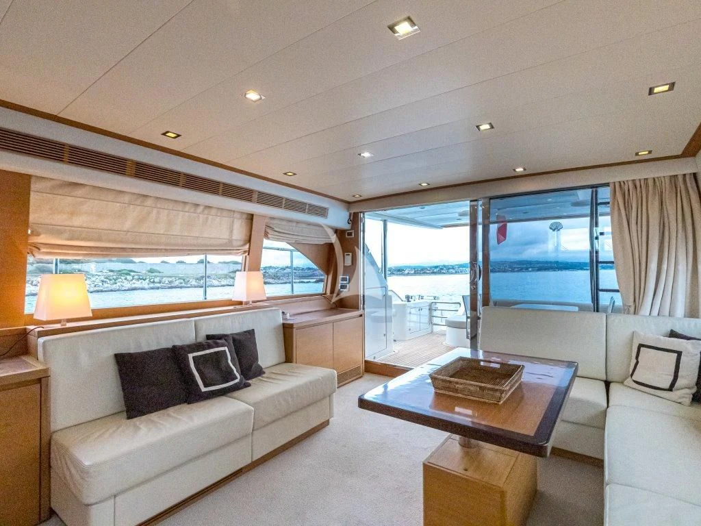 a living room with a large window aboard PASSION Yacht for Sale