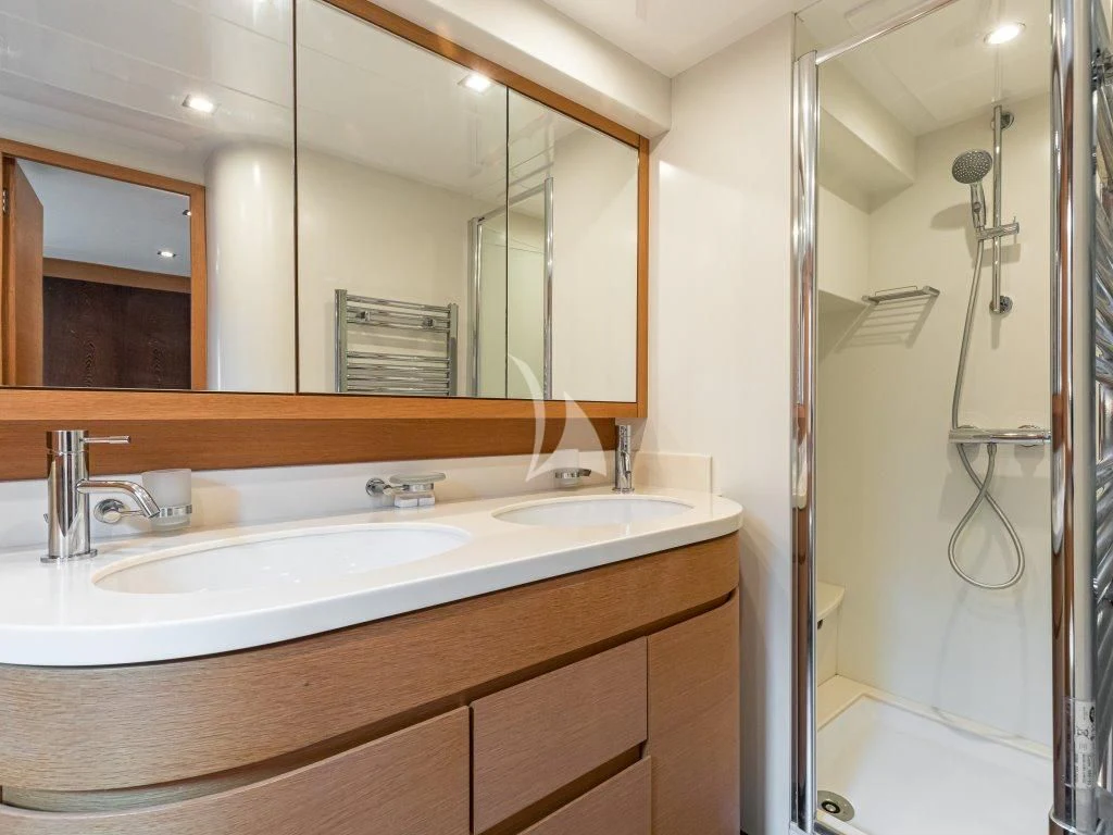 a bathroom with a large mirror aboard PASSION Yacht for Sale