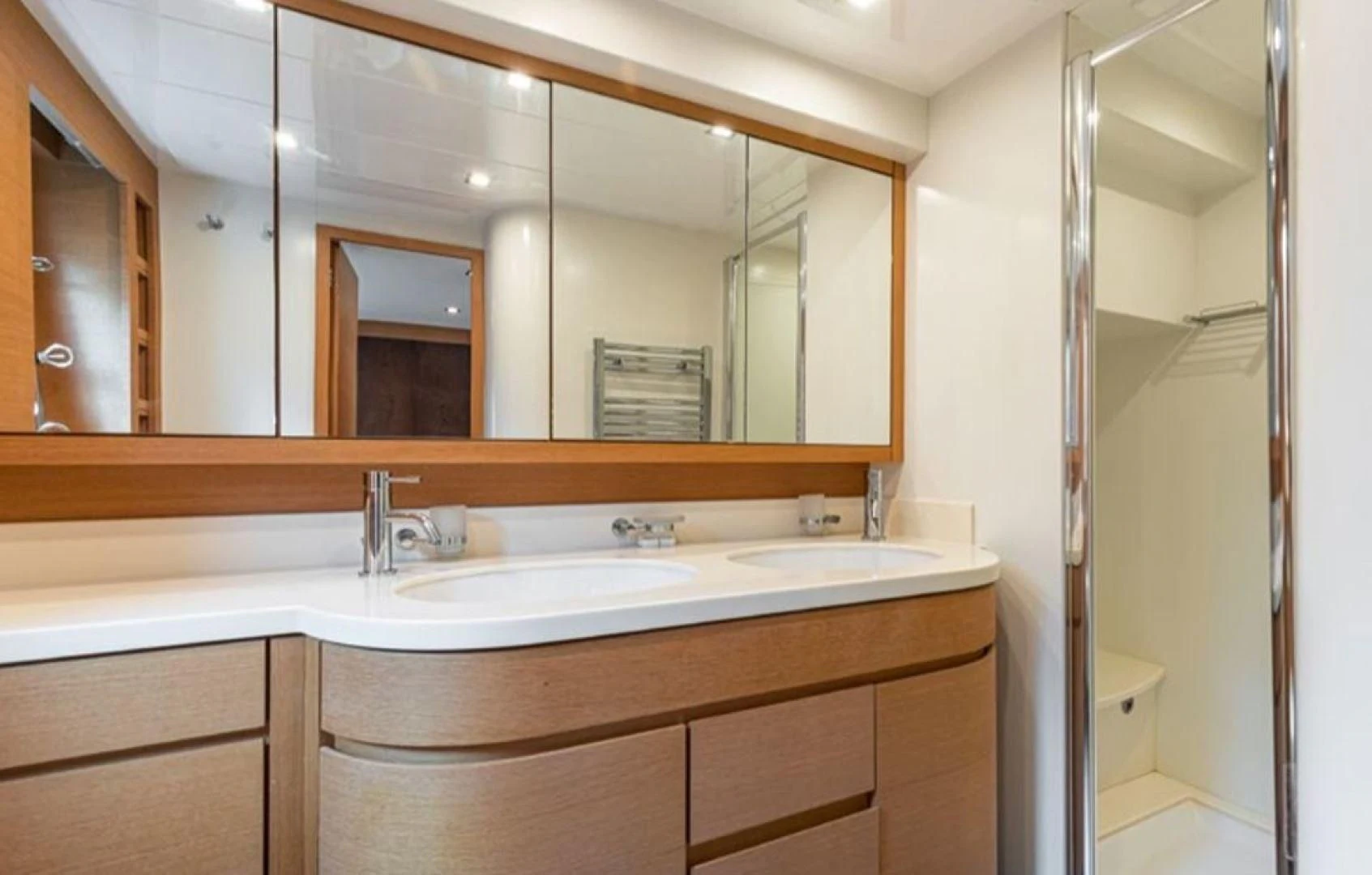 a bathroom with a large mirror aboard PASSION Yacht for Sale