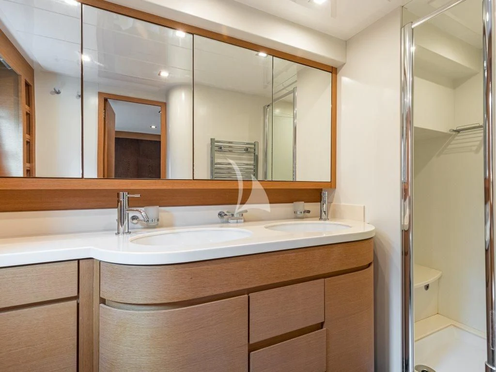 a bathroom with a large mirror aboard PASSION Yacht for Sale