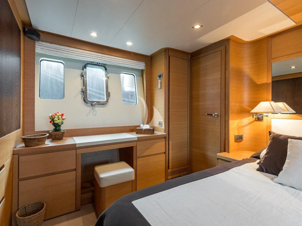 a hotel room with a bed and a sink aboard PASSION Yacht for Sale