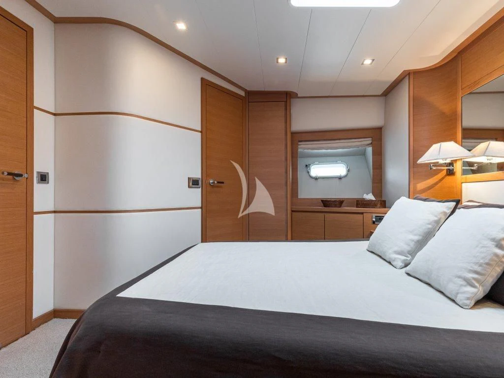 a bed with a white sheet aboard PASSION Yacht for Sale