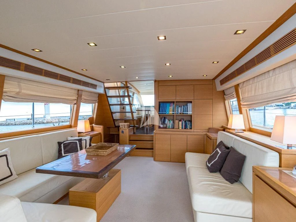 a living room with a large window aboard PASSION Yacht for Sale