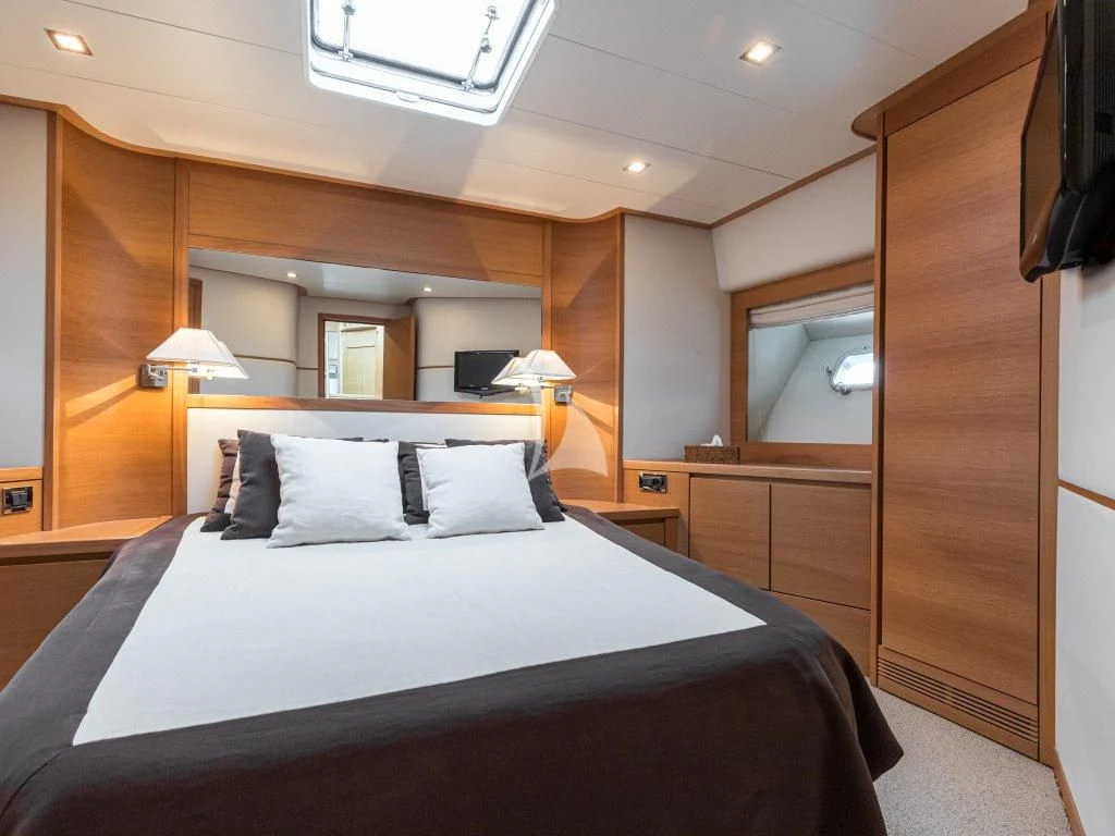 a bed in a room aboard PASSION Yacht for Sale