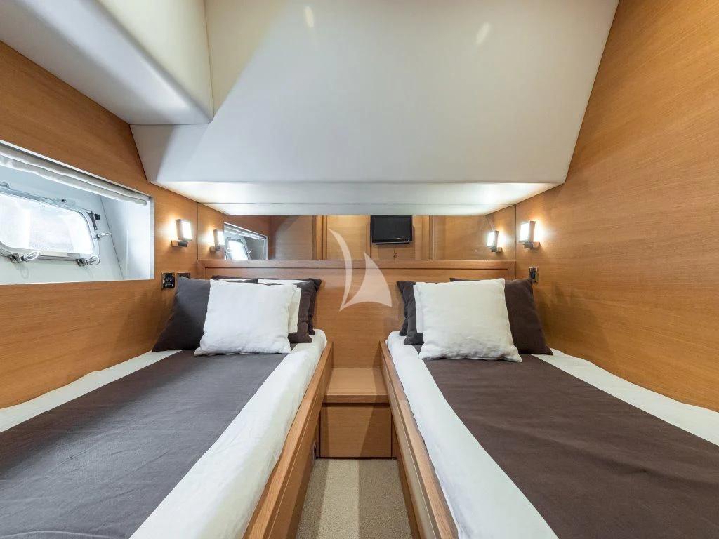 a room with two beds aboard PASSION Yacht for Sale