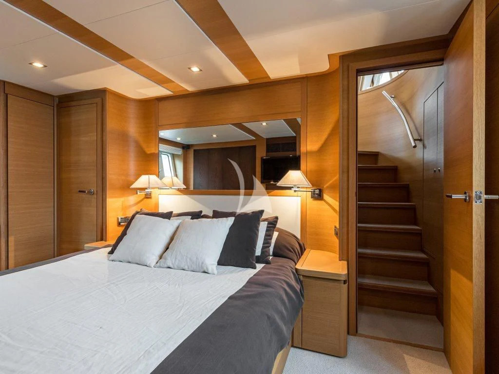 a bed in a hotel room aboard PASSION Yacht for Sale