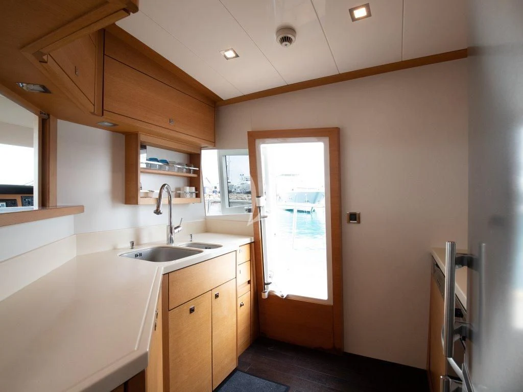 a kitchen with a sink and a window aboard PASSION Yacht for Sale