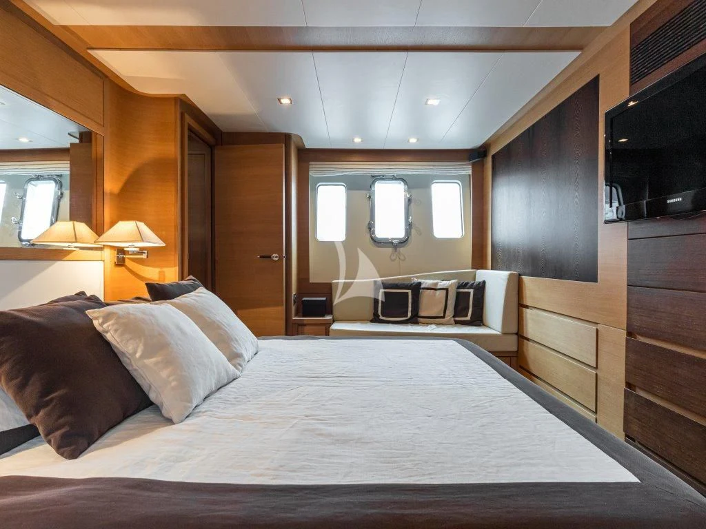 a bed with a white sheet aboard PASSION Yacht for Sale