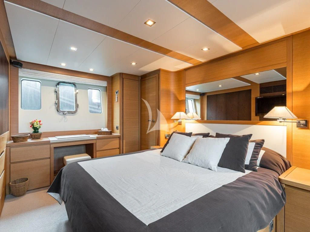 a large bed in a room aboard PASSION Yacht for Sale