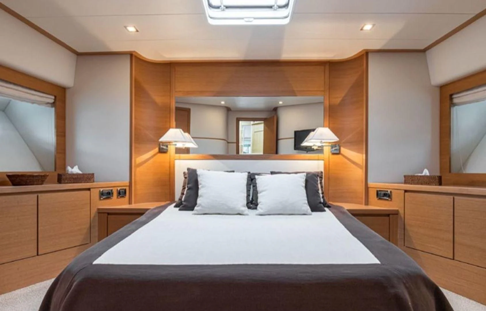 a large bed in a hotel room aboard PASSION Yacht for Sale