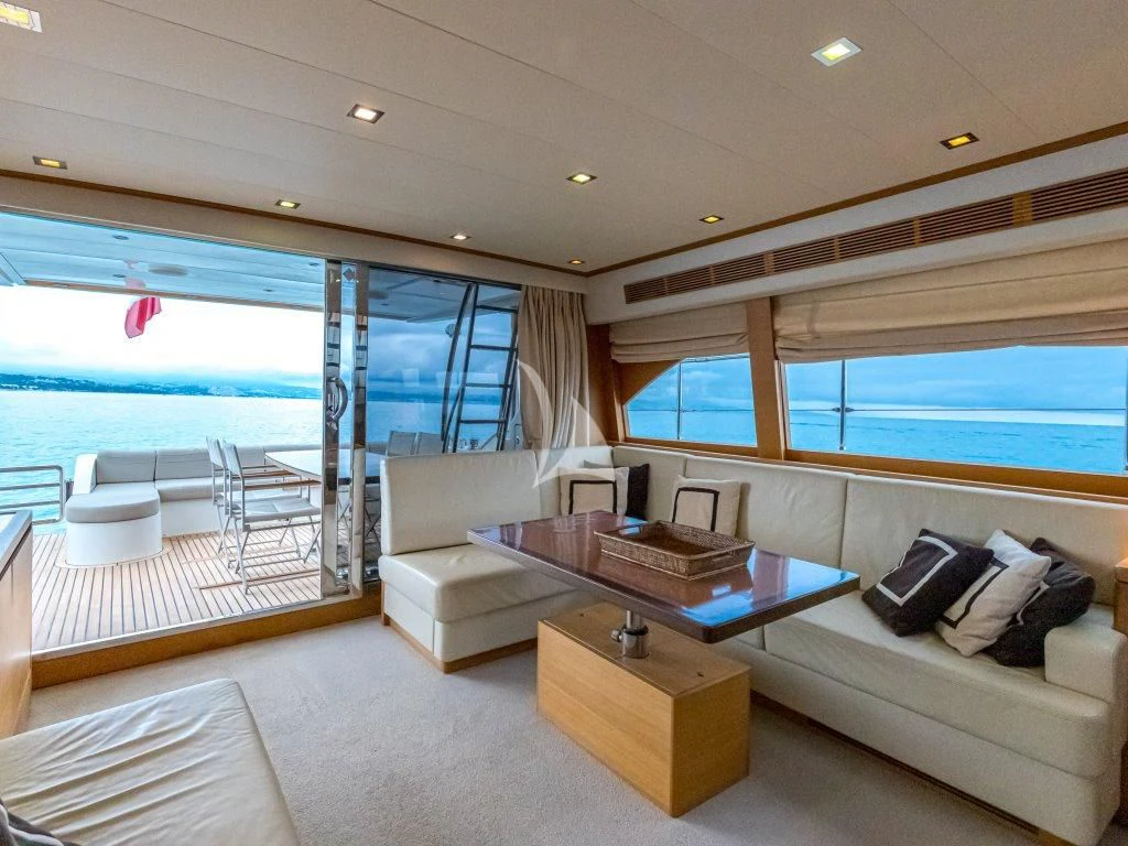 a living room with a large window aboard PASSION Yacht for Sale