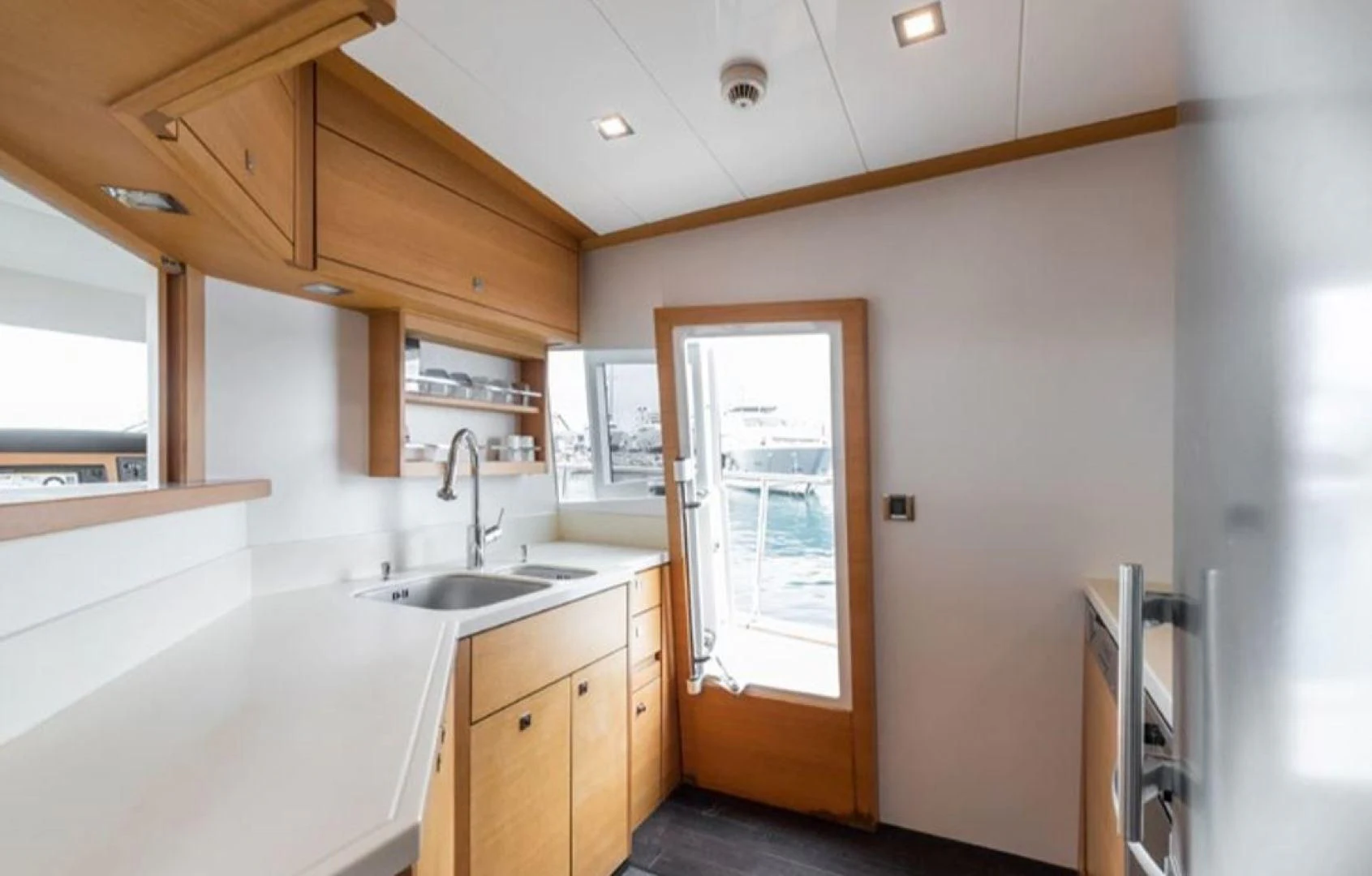 a kitchen with a sink and cabinets aboard PASSION Yacht for Sale