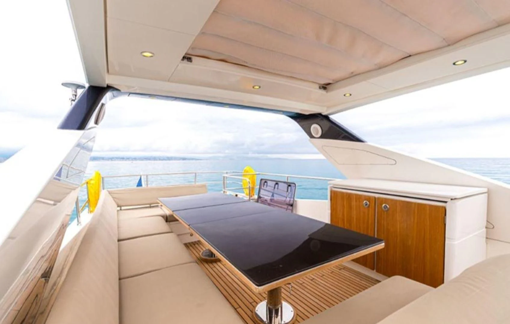 a boat with a deck and a pool aboard PASSION Yacht for Sale