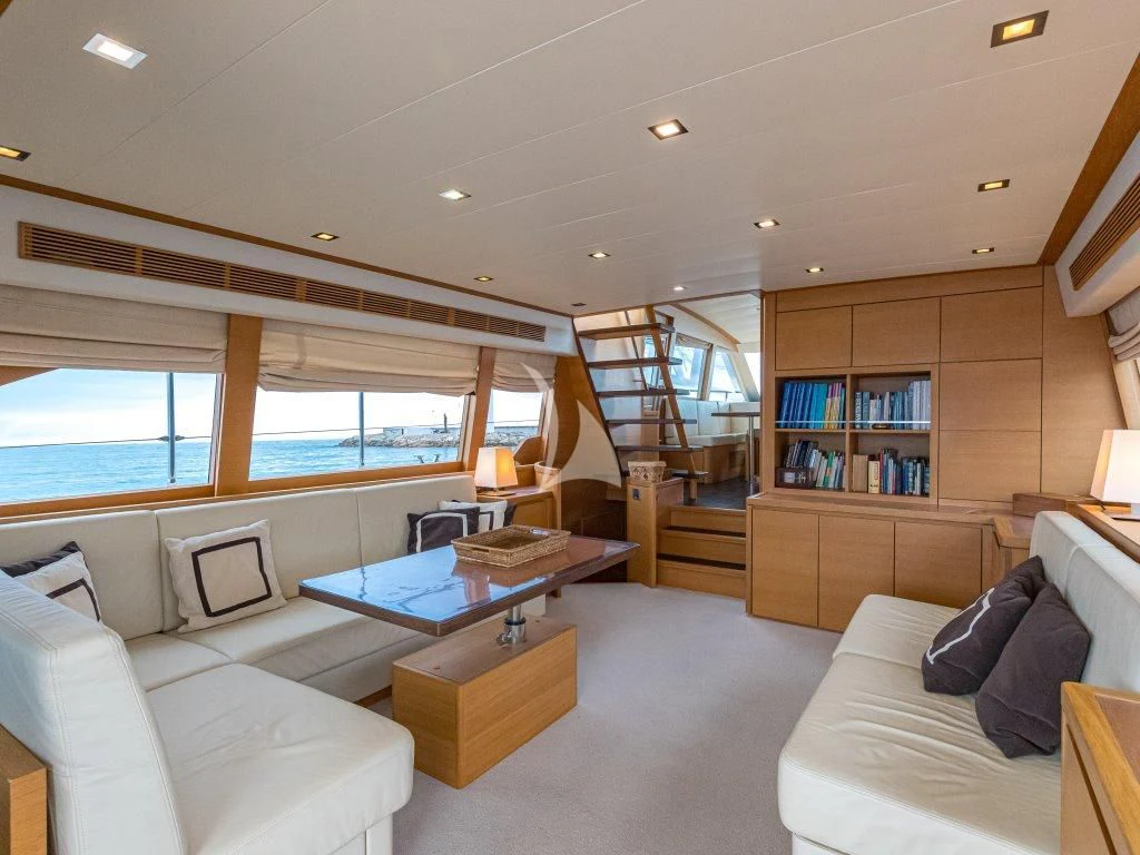 a living room with a large window aboard PASSION Yacht for Sale