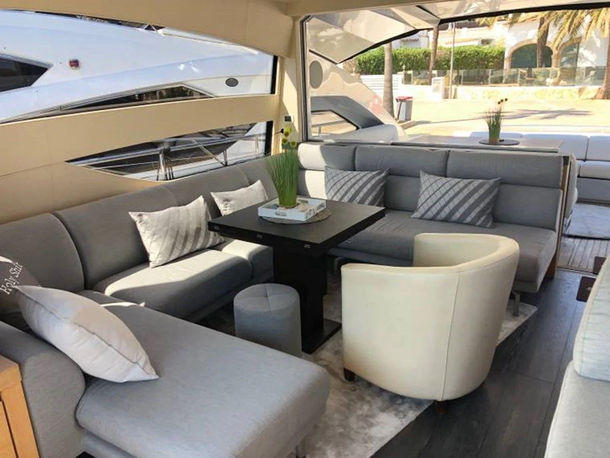 a living room with a couch and a table aboard HOLY SHIT Yacht for Sale