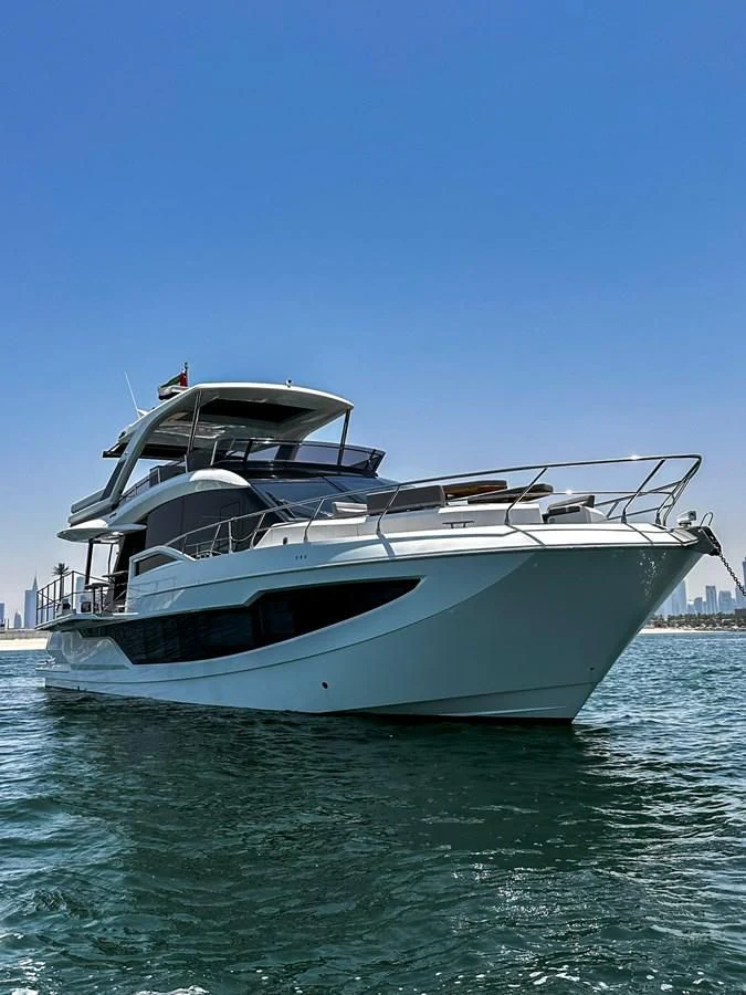 a white yacht on the water aboard JANICE Yacht for Sale