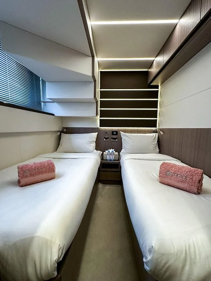 a couple of beds in a room aboard JANICE Yacht for Sale
