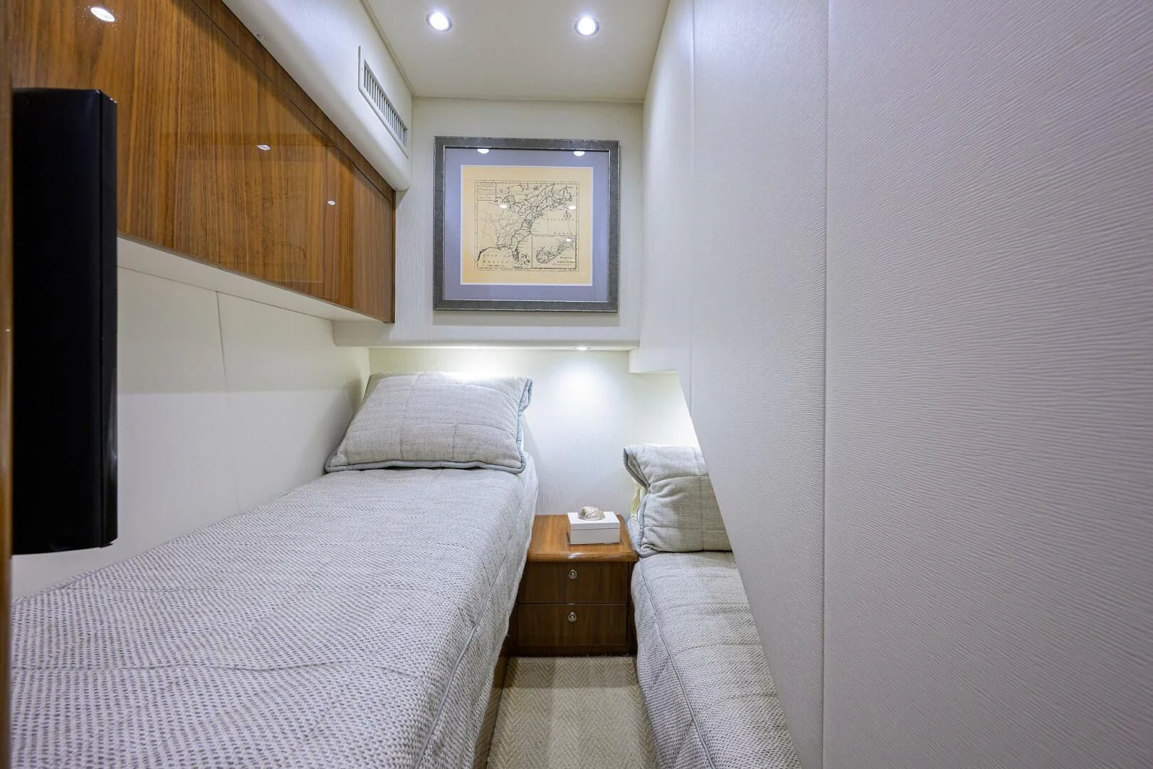 a room with a bed and a desk aboard TEAM MAYHEM Yacht for Sale