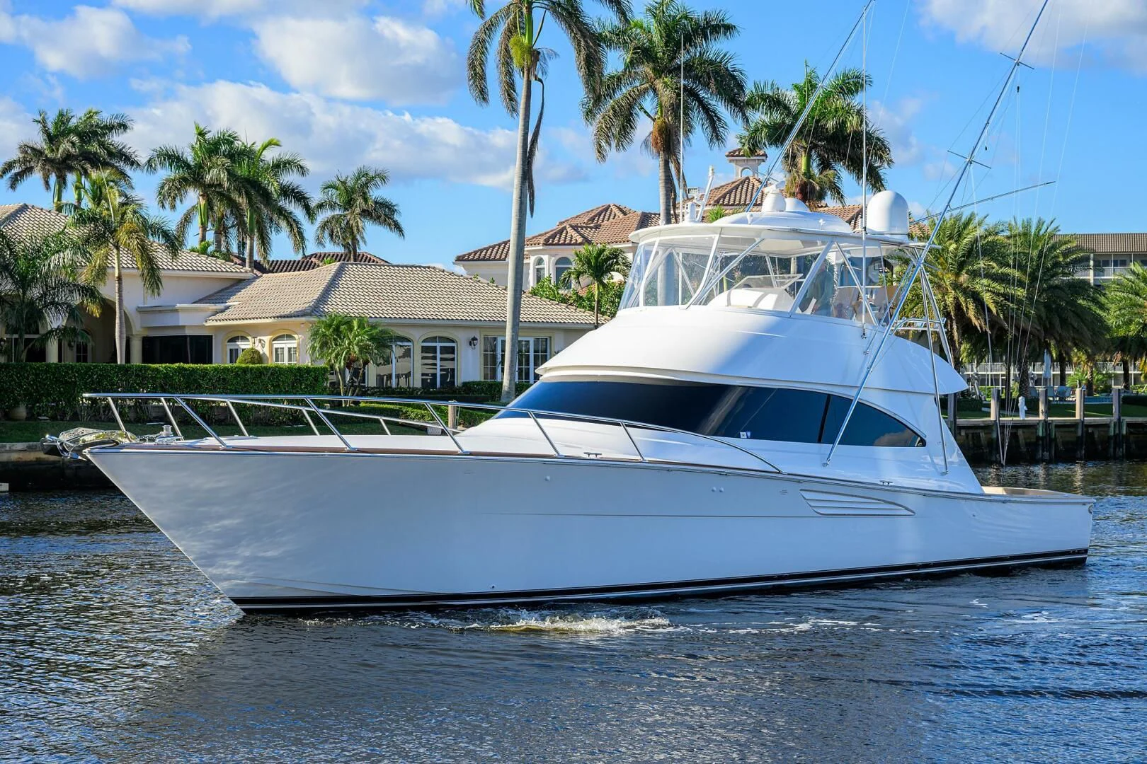 a white yacht in the water aboard TEAM MAYHEM Yacht for Sale