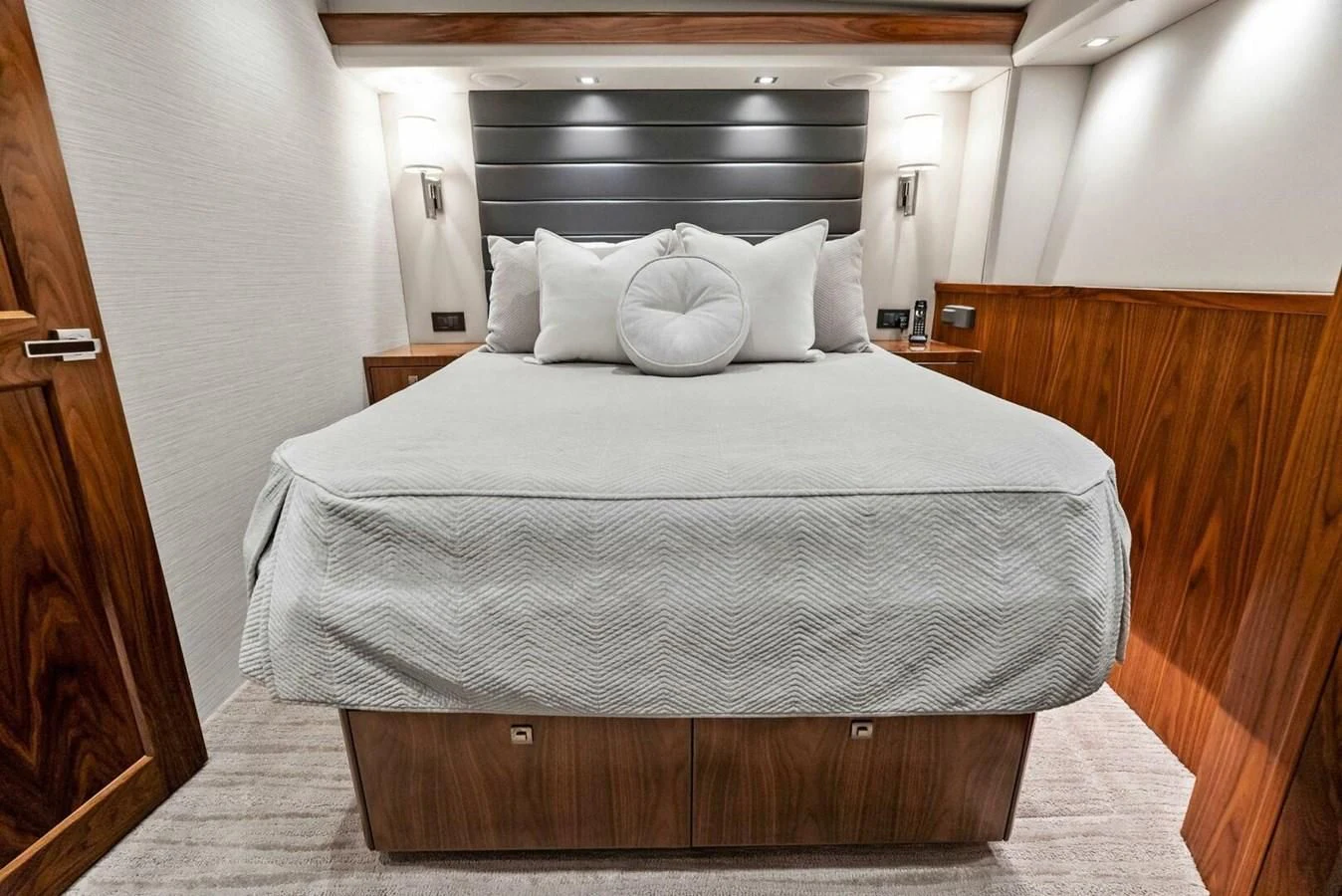a bed with white sheets aboard TEAM MAYHEM Yacht for Sale