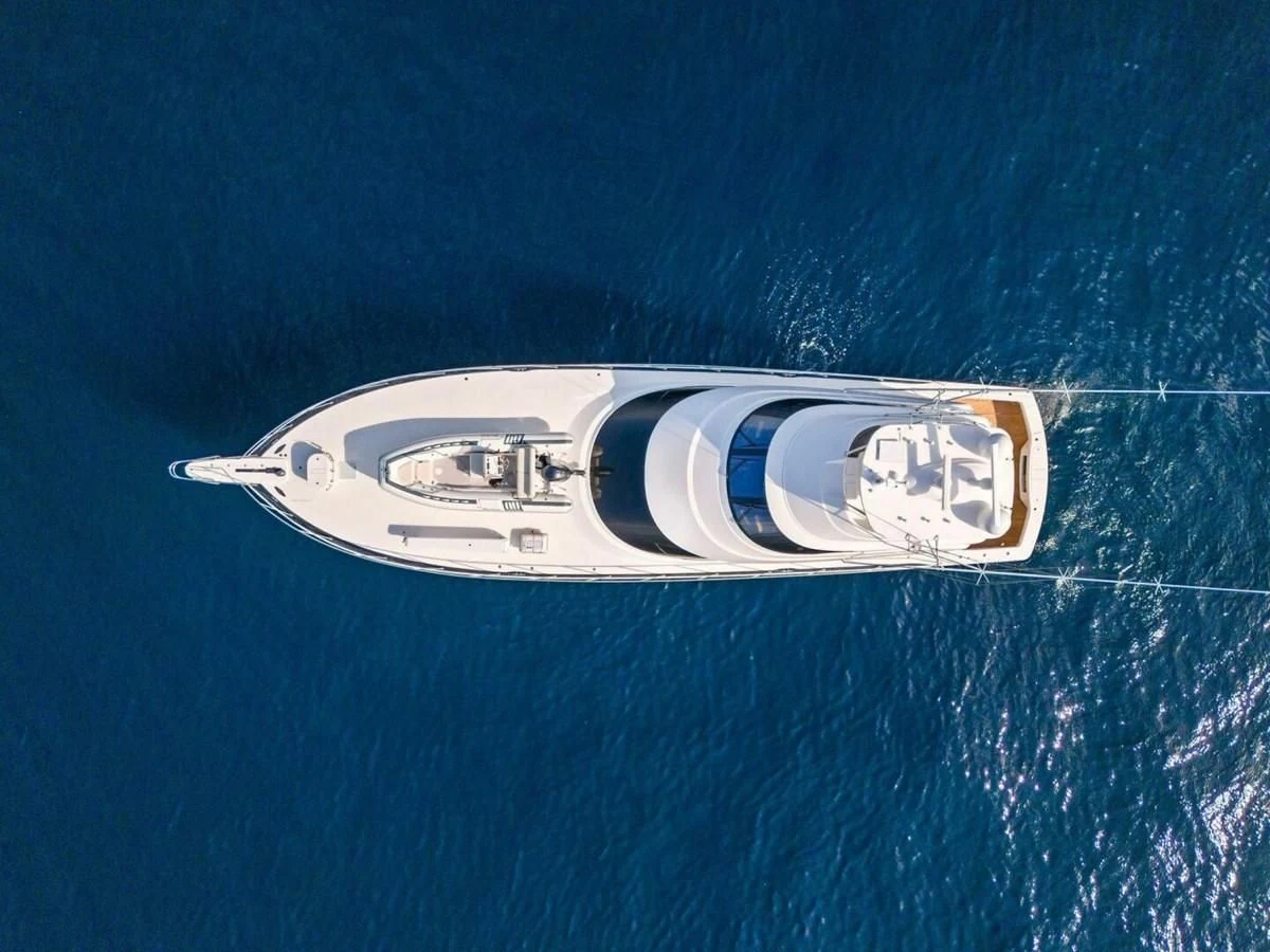 a silver and gold logo aboard TEAM MAYHEM Yacht for Sale