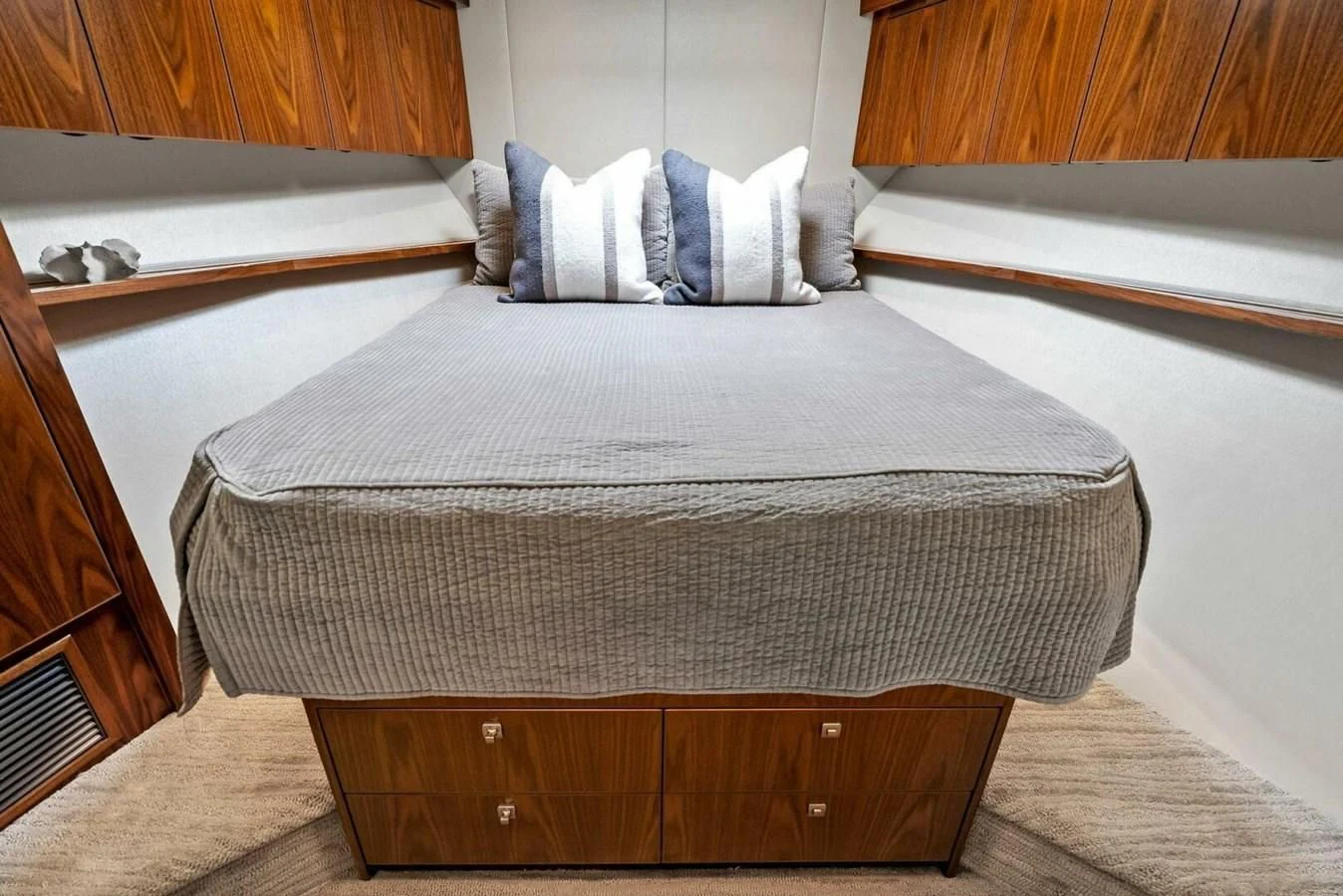 a bed with a white comforter aboard TEAM MAYHEM Yacht for Sale