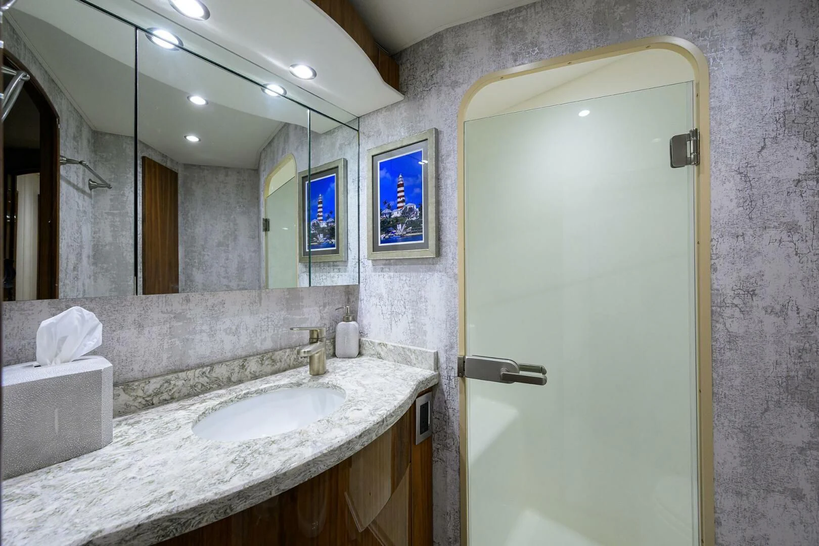 a bathroom with a large mirror aboard TEAM MAYHEM Yacht for Sale