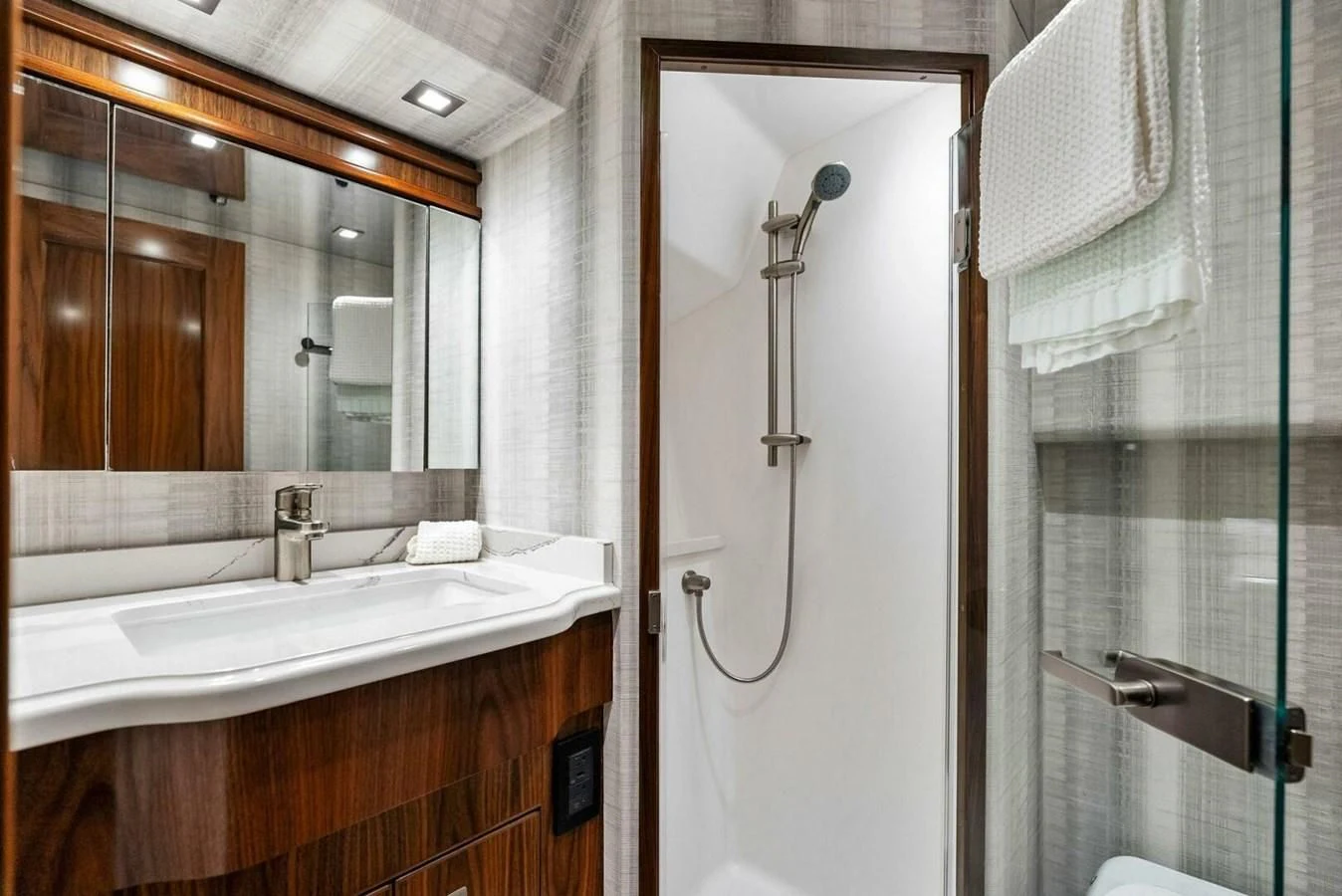 a bathroom with a shower and sink aboard TEAM MAYHEM Yacht for Sale