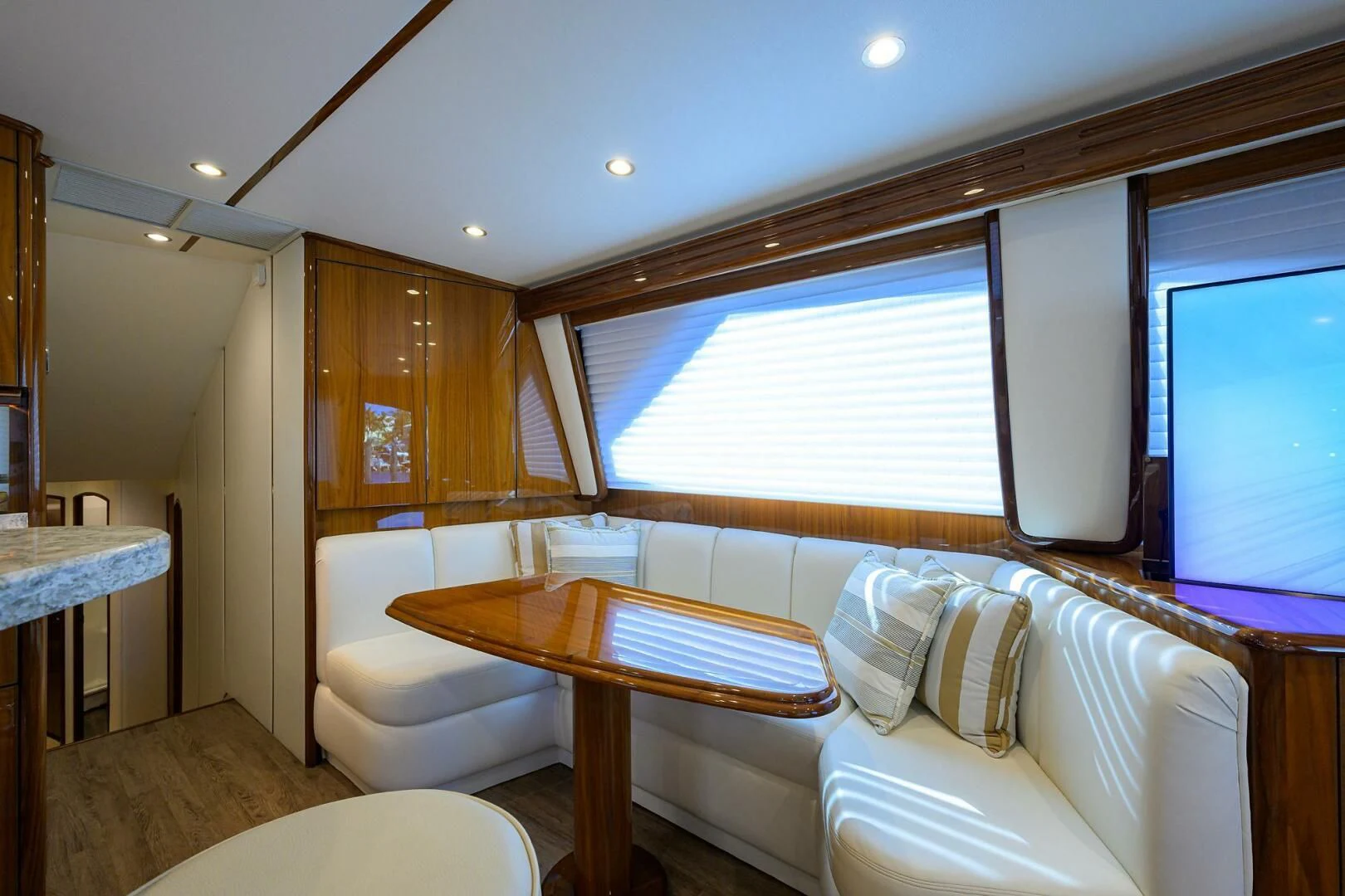 a room with a bed and a table aboard TEAM MAYHEM Yacht for Sale