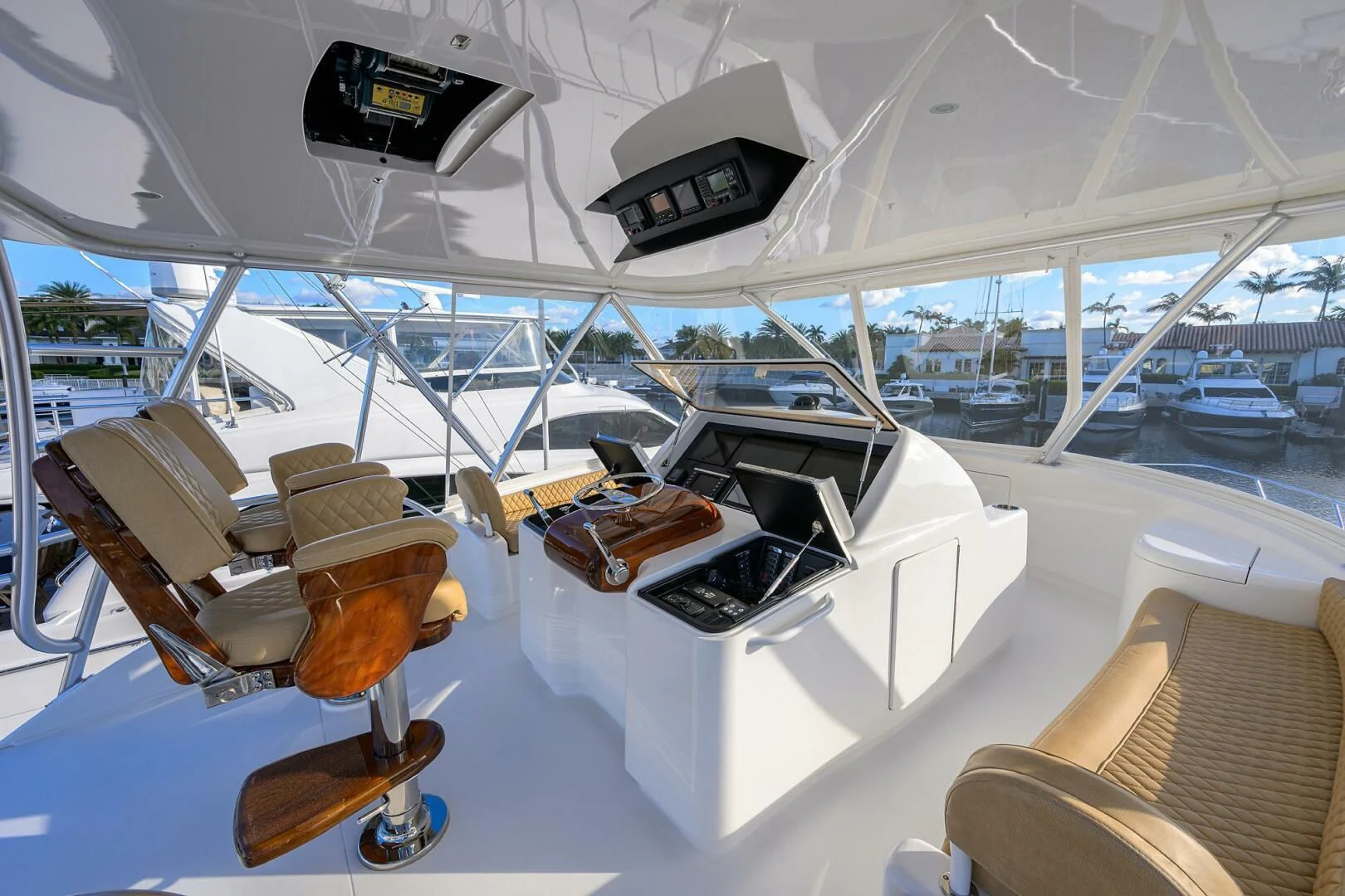 a boat with a table and chairs aboard TEAM MAYHEM Yacht for Sale