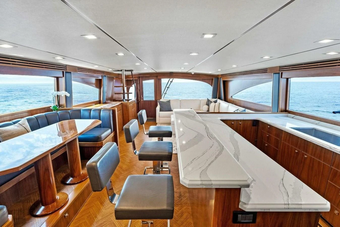 a room with a table and chairs aboard TEAM MAYHEM Yacht for Sale