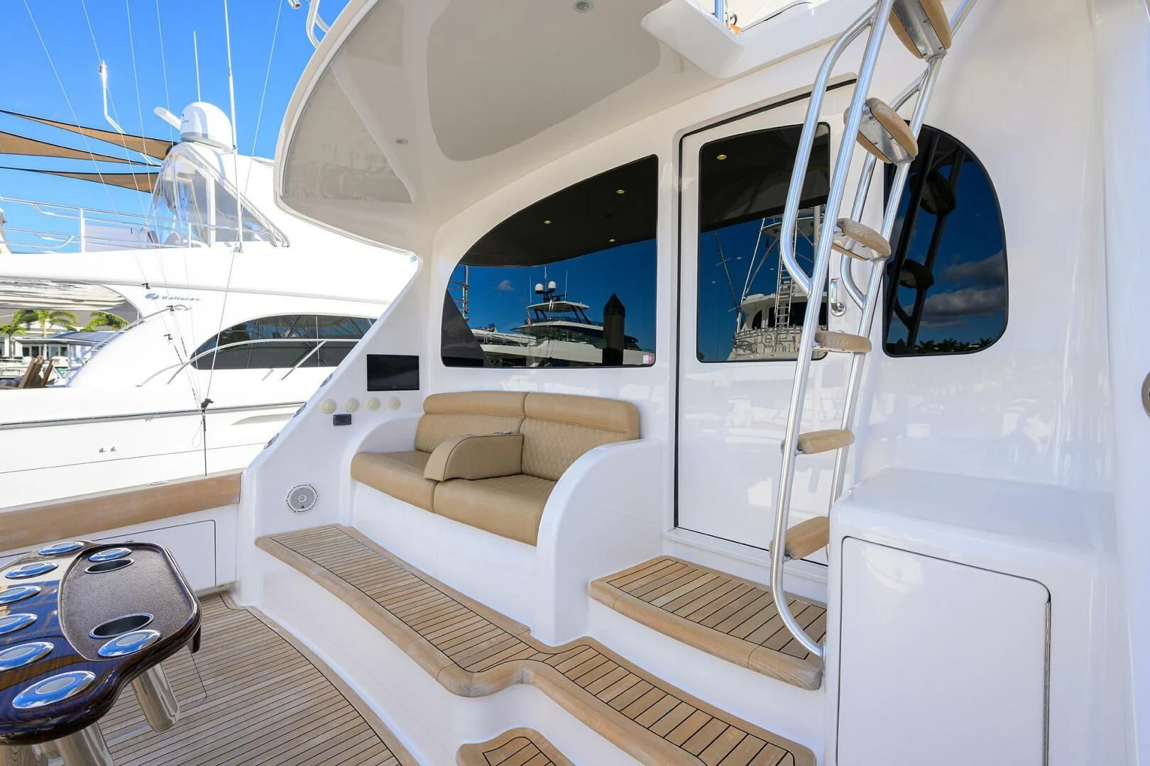 a boat with a bench aboard TEAM MAYHEM Yacht for Sale