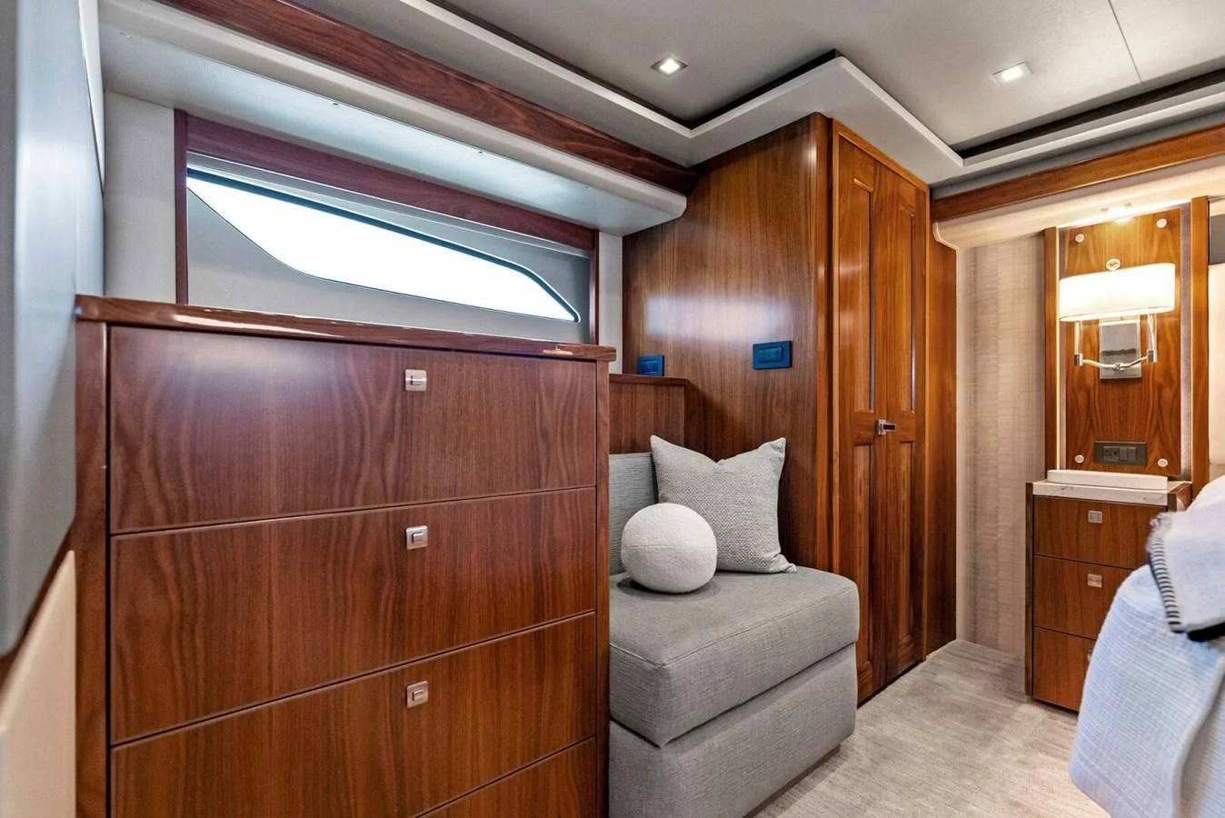 a room with a couch and a bed aboard TEAM MAYHEM Yacht for Sale