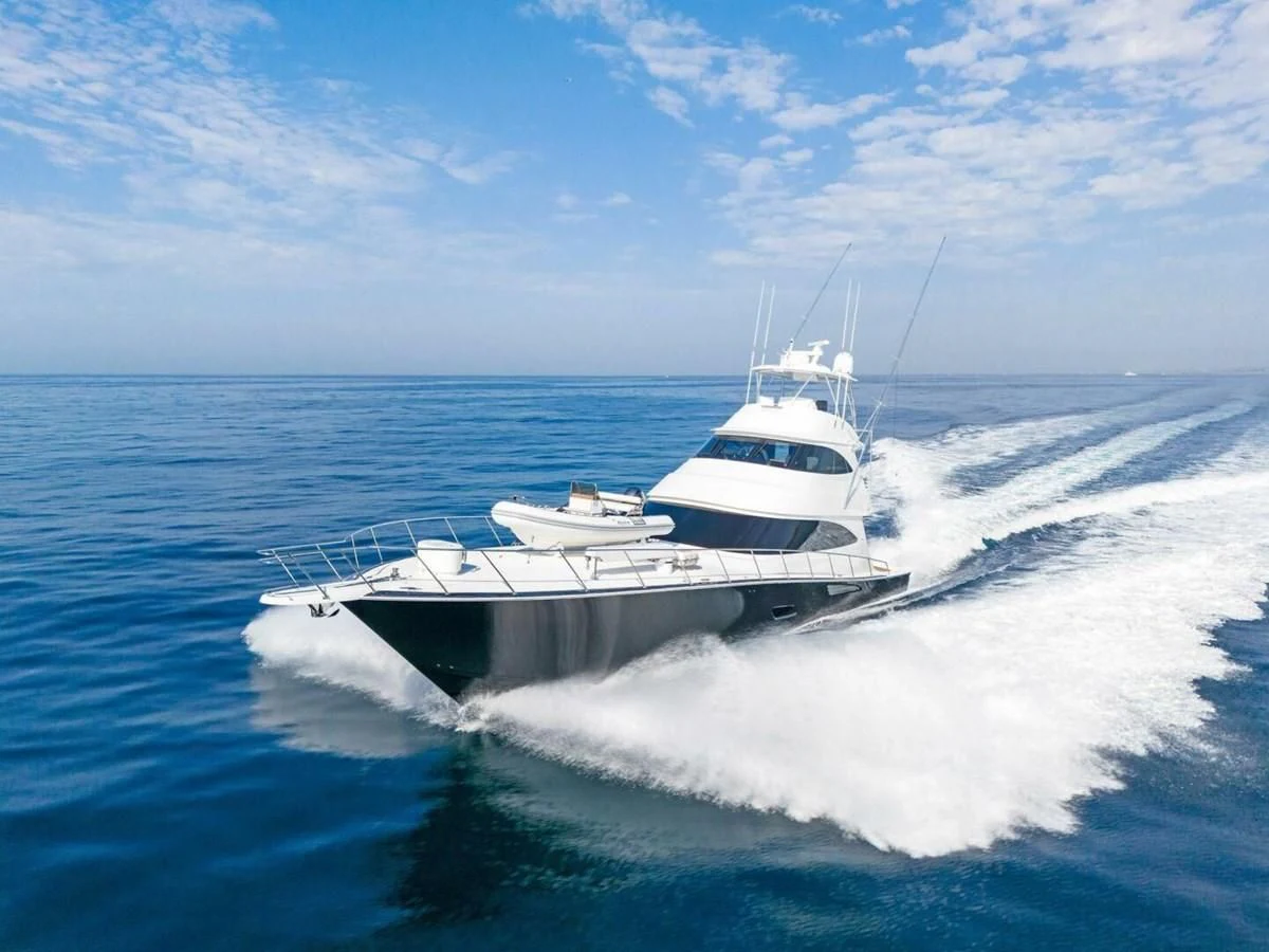 a white yacht on the water aboard TEAM MAYHEM Yacht for Sale