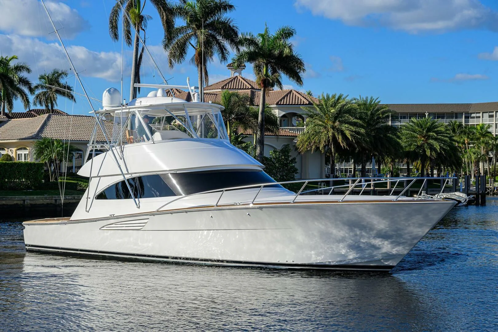 a white boat on the water aboard TEAM MAYHEM Yacht for Sale