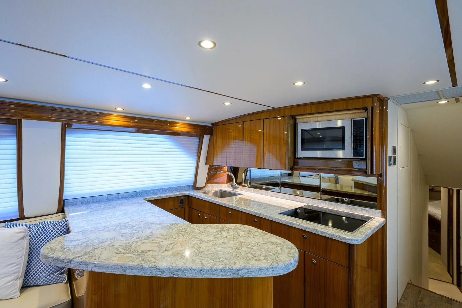 a kitchen with a microwave oven aboard TEAM MAYHEM Yacht for Sale