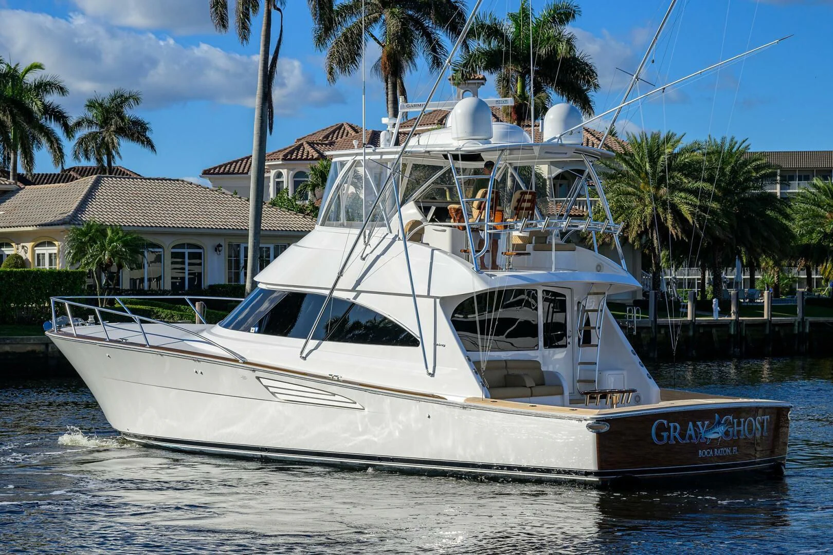 a white boat on the water aboard TEAM MAYHEM Yacht for Sale