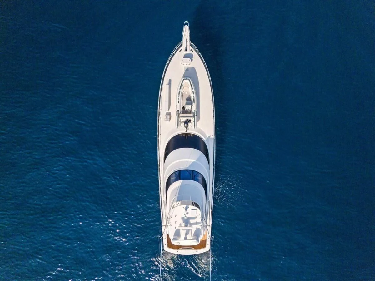 a white and black boat in the water aboard TEAM MAYHEM Yacht for Sale